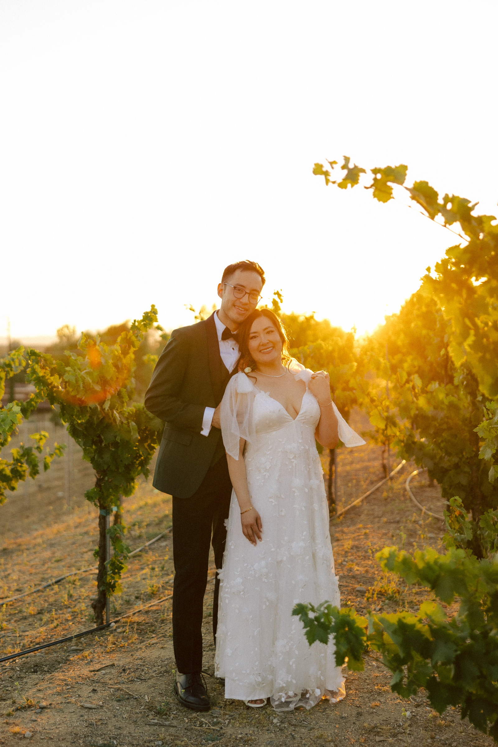 Nancy and Chris walking through the sun-drenched vineyards at Truffle Pig Winery in Temecula.
