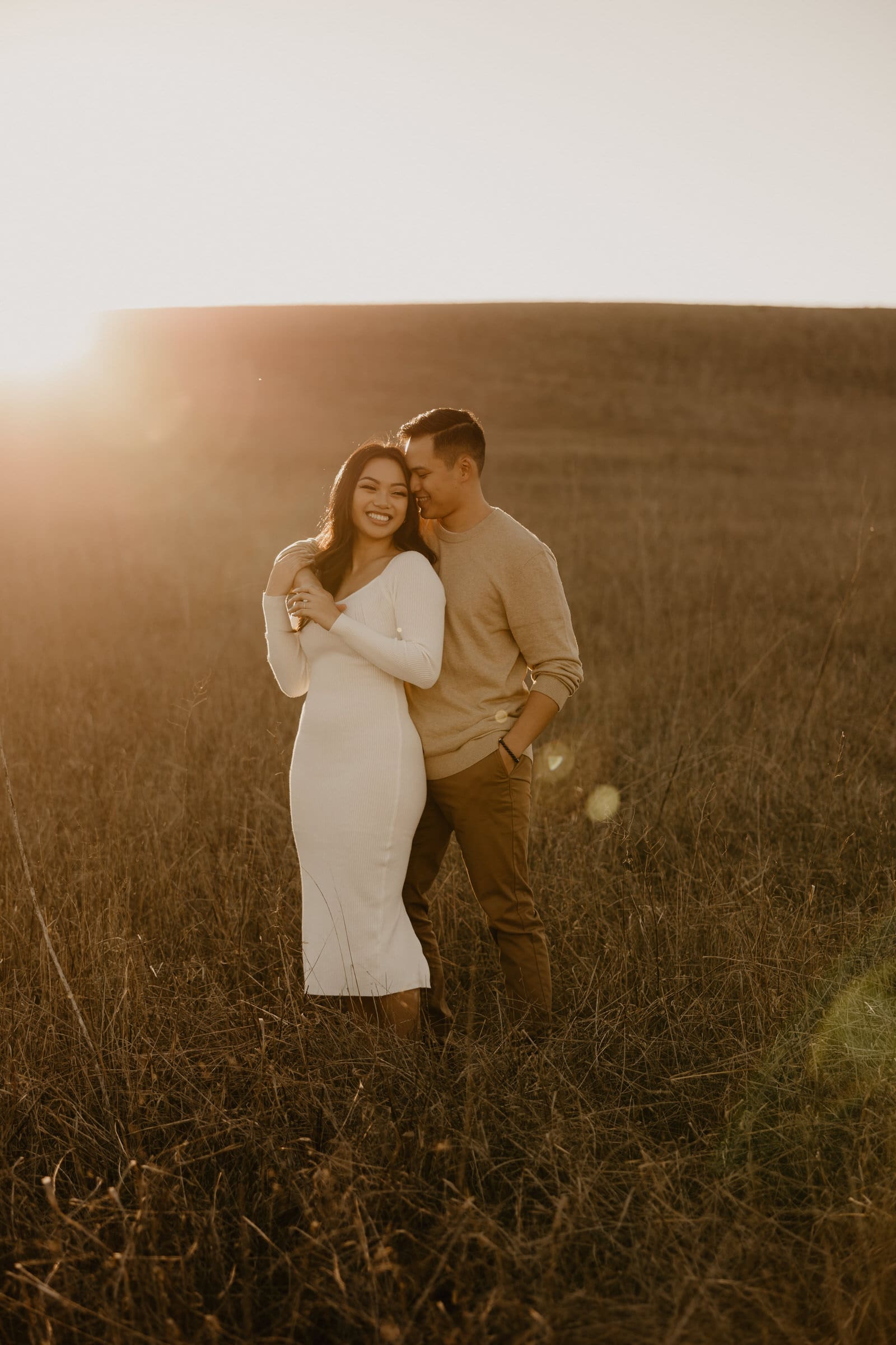 Couples engagement session in the golden wheat fields at Quail Hill Trail in Irvine.