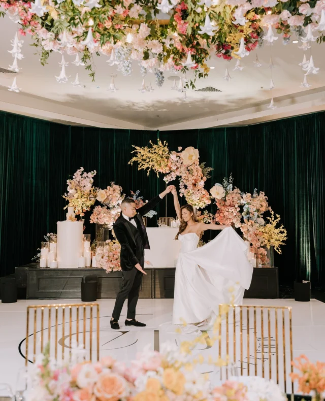 A reception straight out of a dream 💐✨ Opulent blooms in vivid spring hues, cascading from every corner, paired with lush green velvet drapery and golden accents that glimmered all night long. A romantic, regal wonderland made just for the newlyweds.