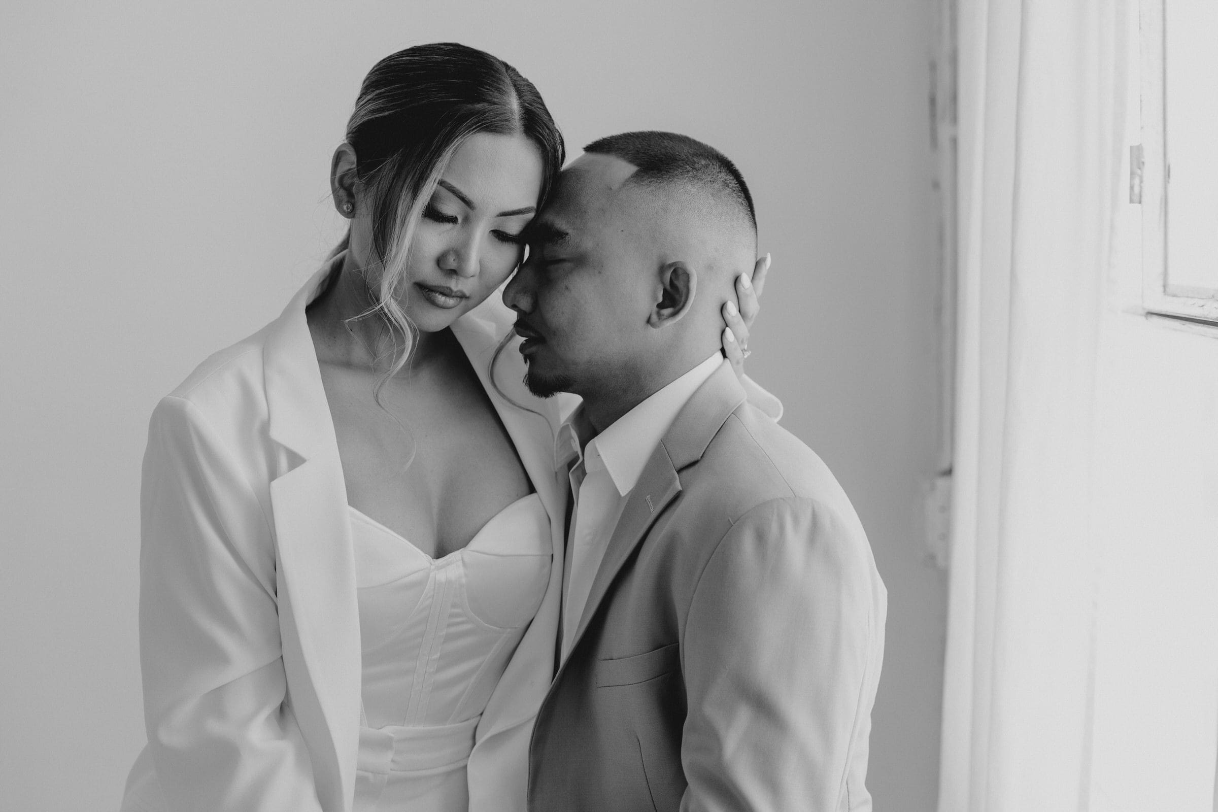 For a Featured Image, the Alt-Text needs to be the "heavy hitter." It should combine your couple's names, the specific location, and the core "vibe" keyword. Depending on which photo you choose as your main featured image, use one of these: Option 1: If the image is a wide shot with the skyline Alt-Text: Pauline and Brandon during their modern minimalist DTLA engagement session with the Los Angeles skyline in the background.