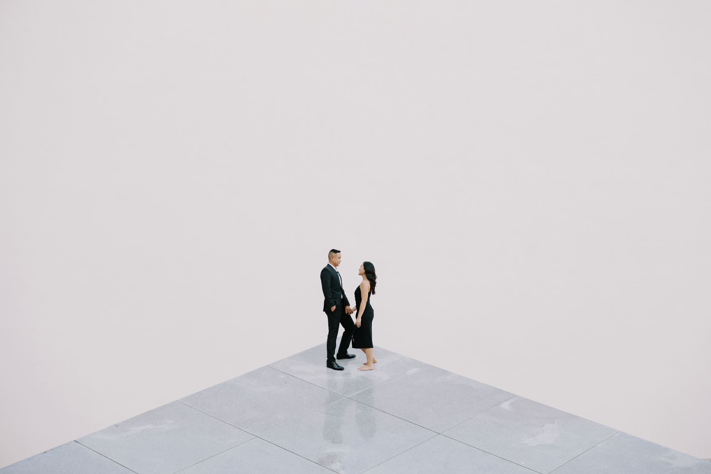 Samantha and Vinh posing in front of the modern architecture at California Scenario (Noguchi Garden) in Costa Mesa.