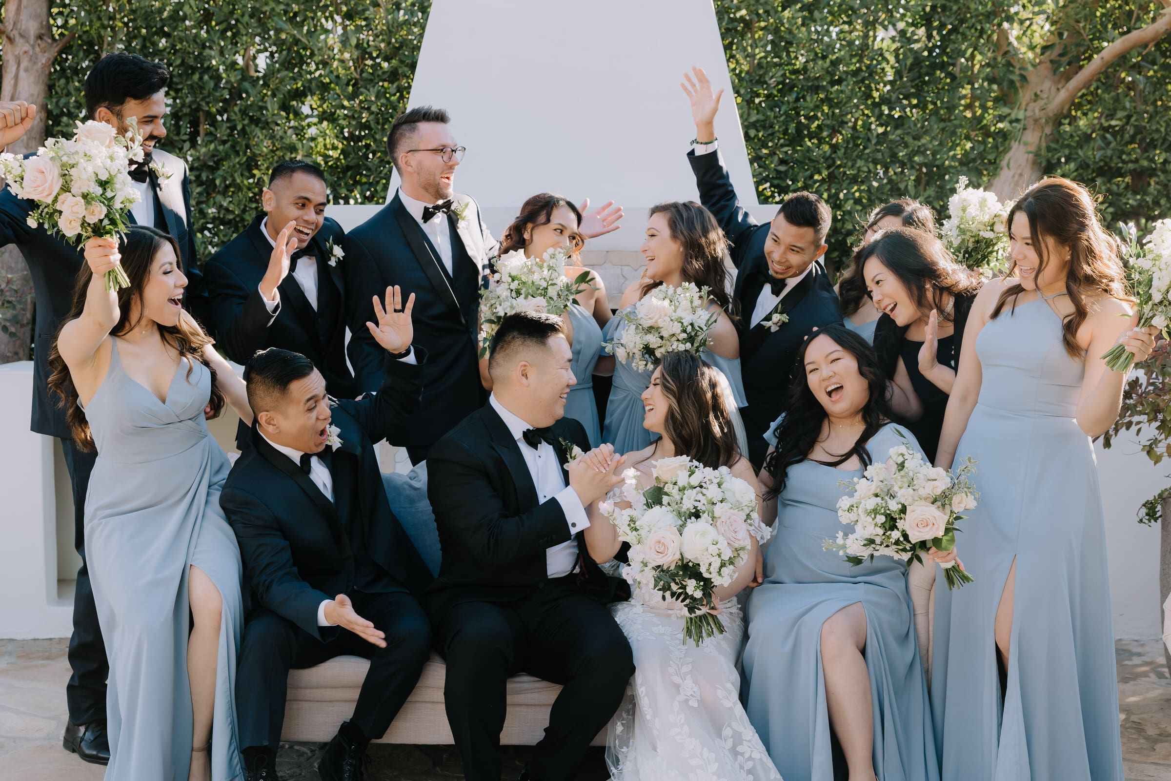 Carolyn and Joseph embracing in the courtyard of Grand Gimeno during their wedding in Old Town Orange.