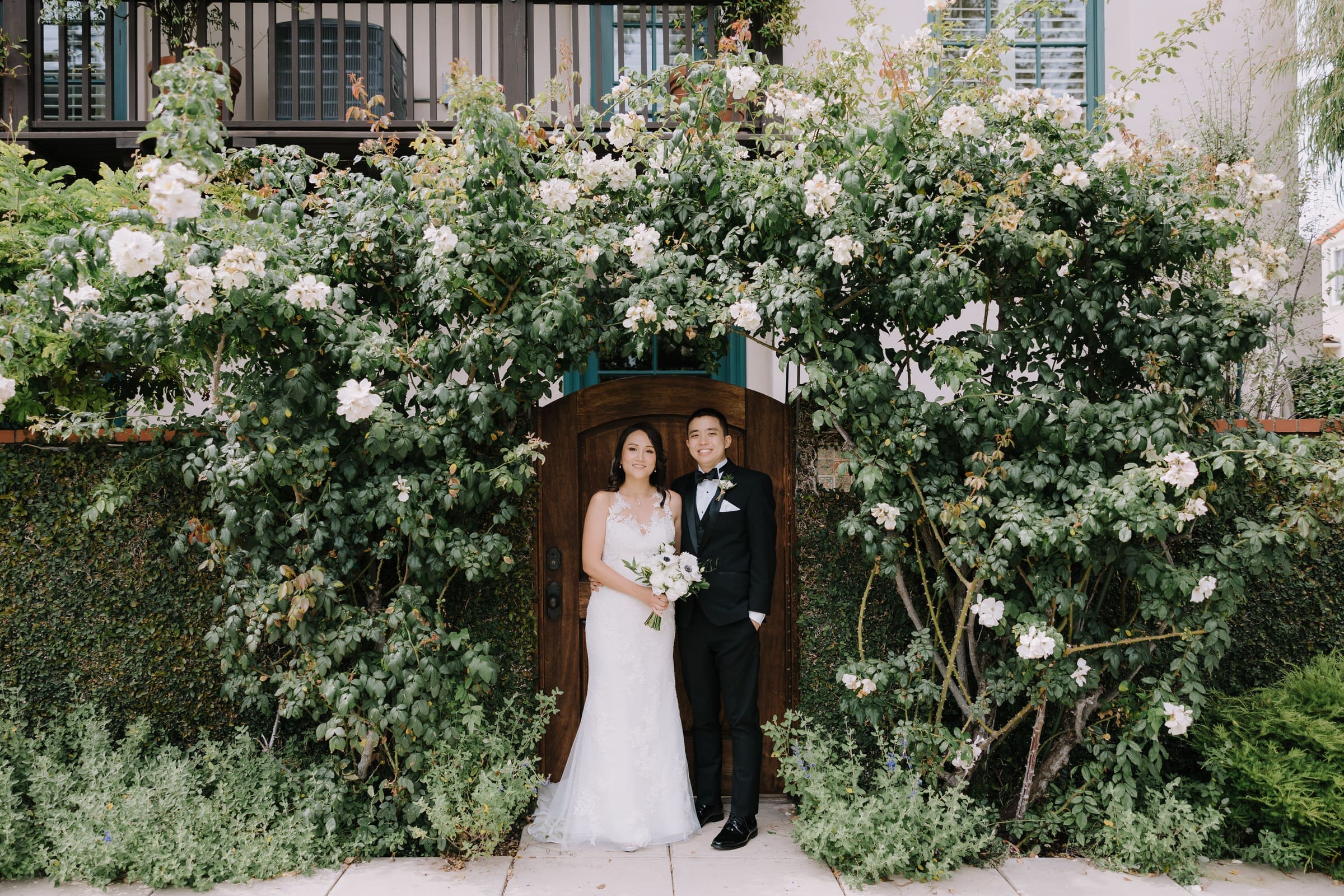 Irene and Daniel posing for wedding portraits on the cliffs near Point Vicente Lighthouse in Palos Verdes.