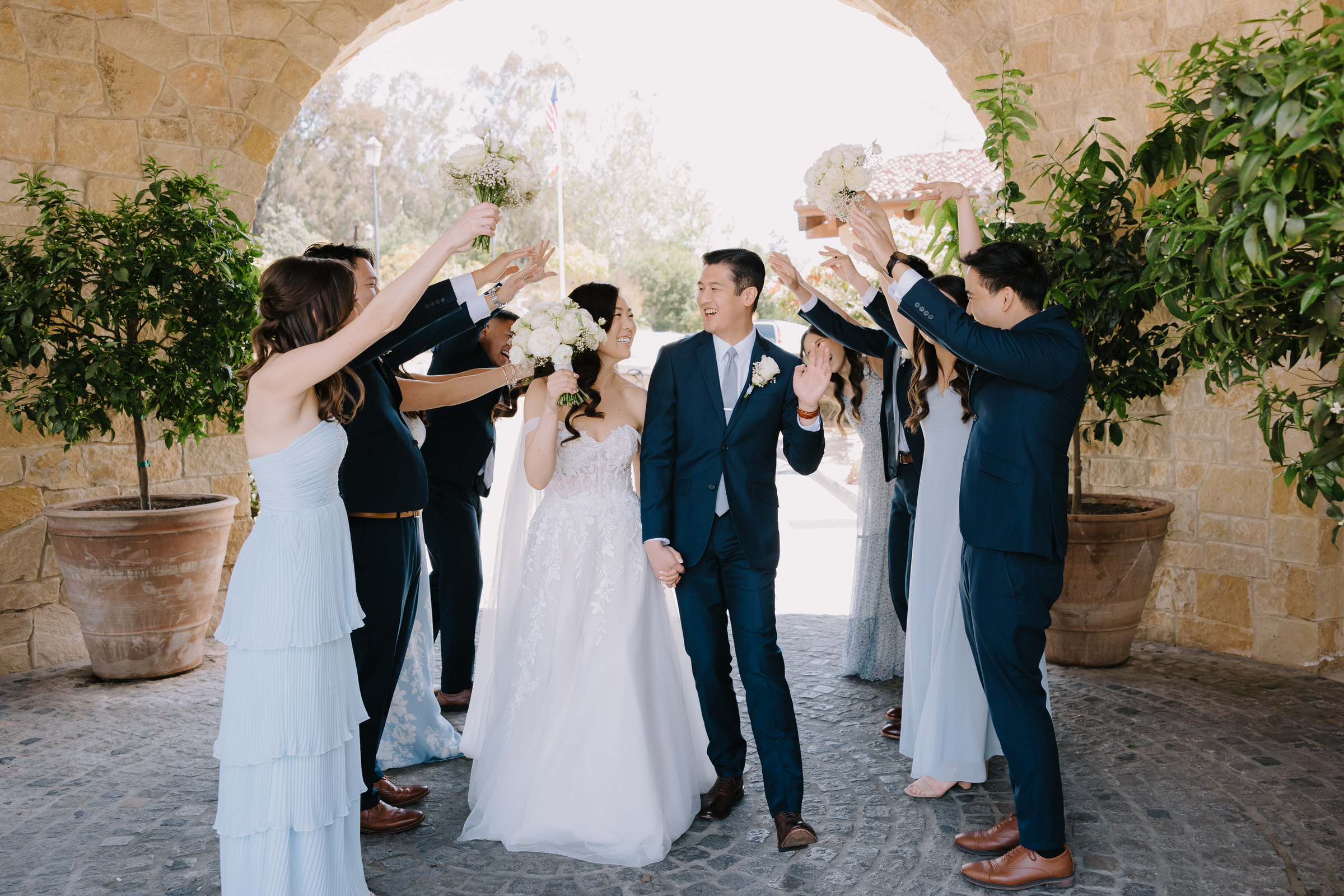 Samantha and Chris stand before 18th-century French gates at The Havens Country Club wedding in Vista.