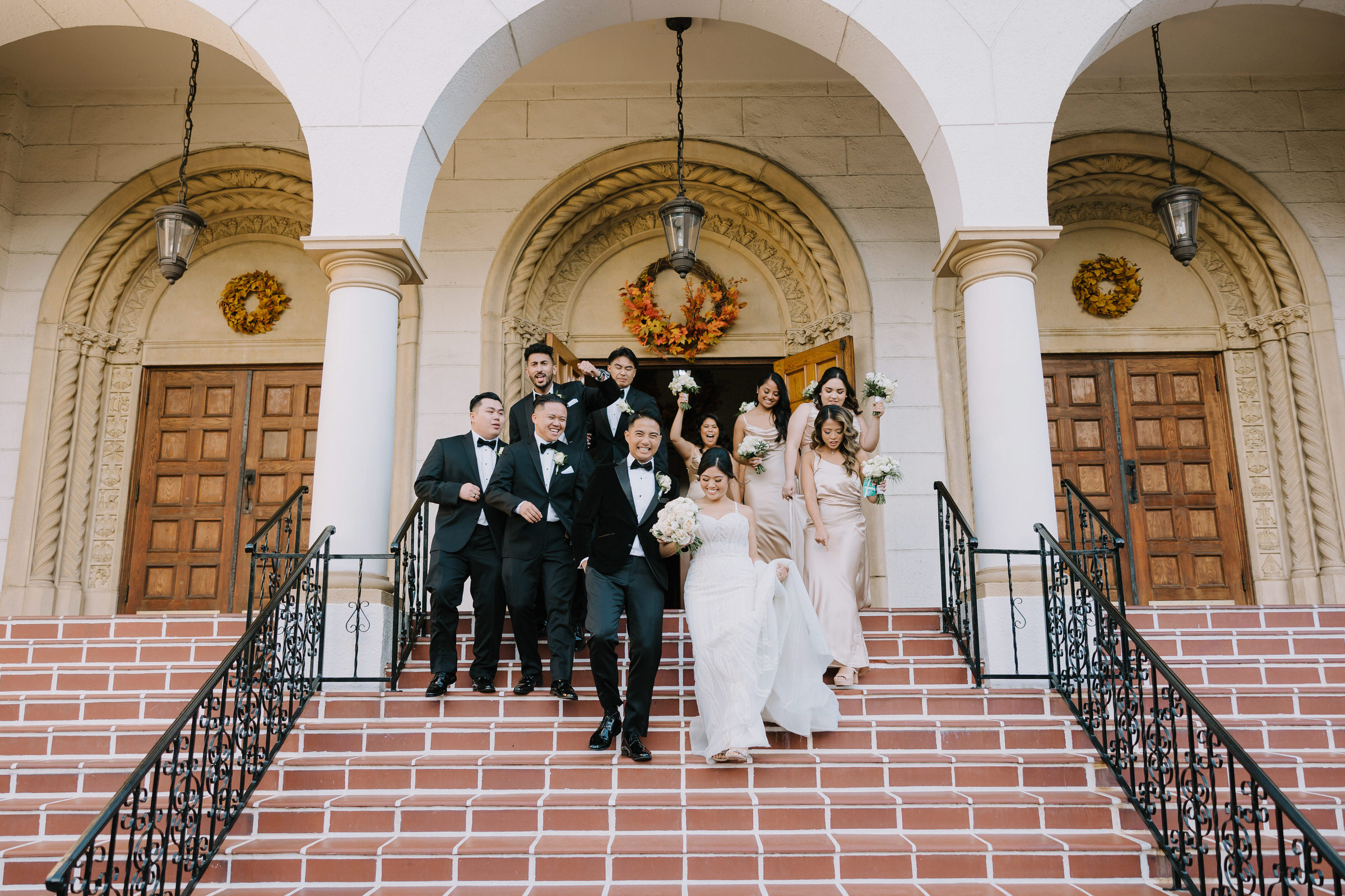 Sam and Ralph posing on the modern terrace at The Lane San Diego with the harbor in the background.