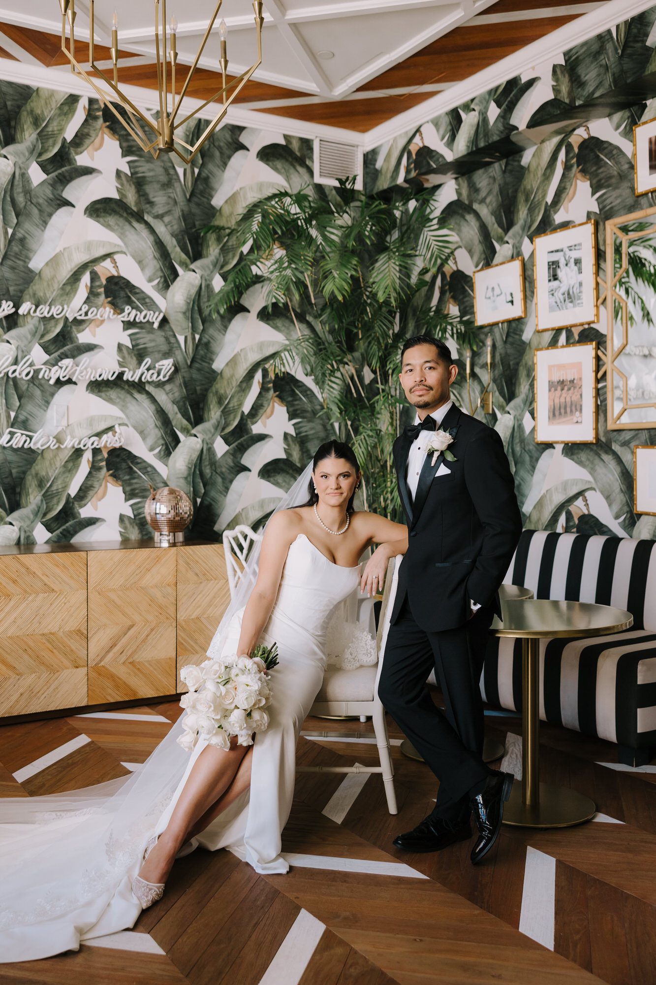 Bride and groom sharing a quiet moment on the vintage Art Deco rooftop of the Oviatt Penthouse overlooking the Downtown Los Angeles skyline.