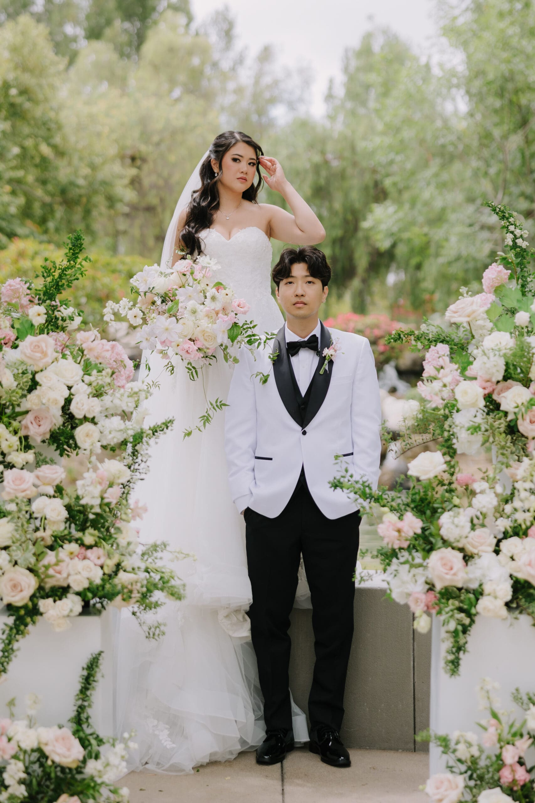ride and groom smiling at their romantic springtime garden wedding at Coyote Hills in Fullerton, California.